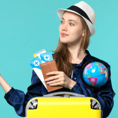 front-view-young-woman-holding-tickets-globe-light-blue-background-plane-sea-vacation-journey-voyage