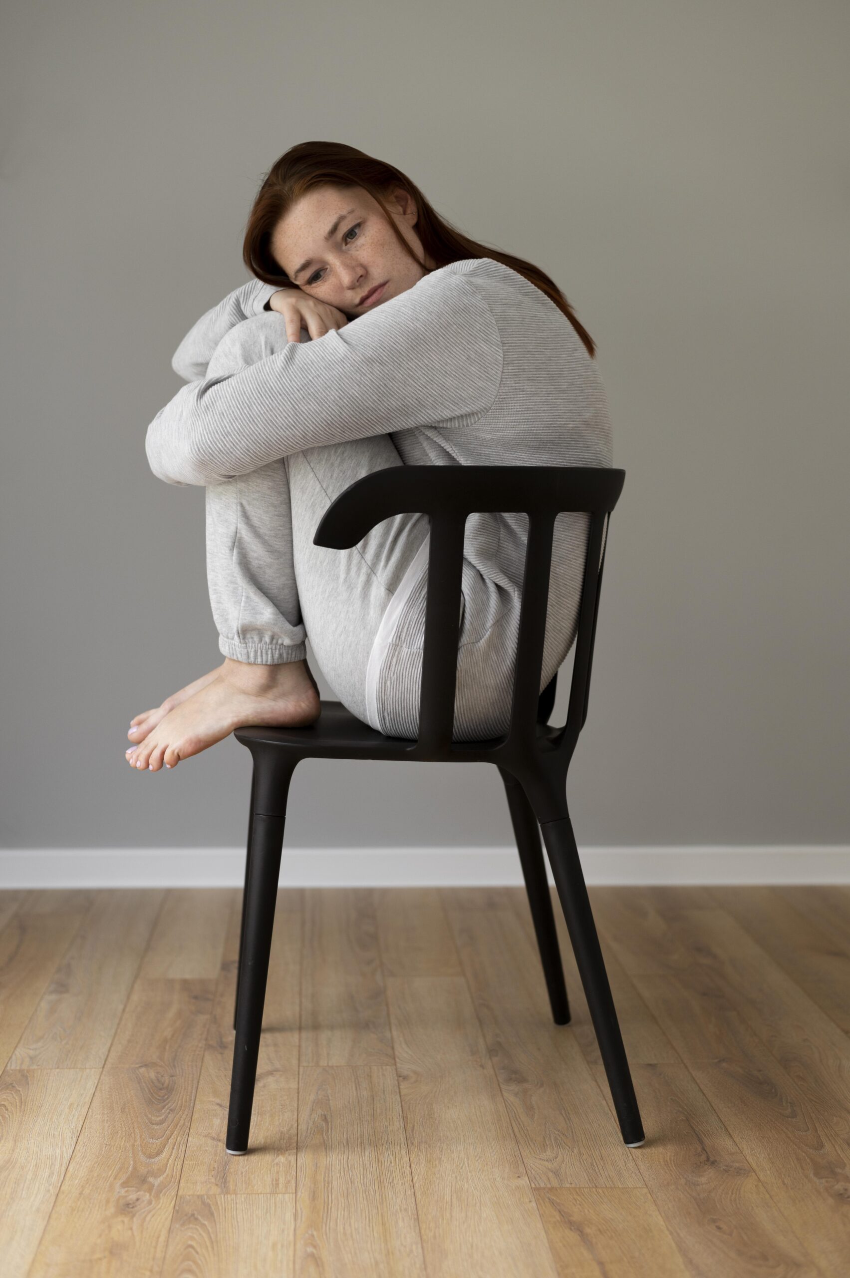 full-shot-woman-sitting-chair